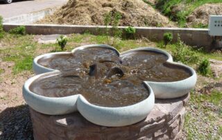 Shamrock Treating Liquid Manure on a Biodynamic Farm. Shamrock Flowform oxygenating and aerating liquid manure using rhythmic water movement